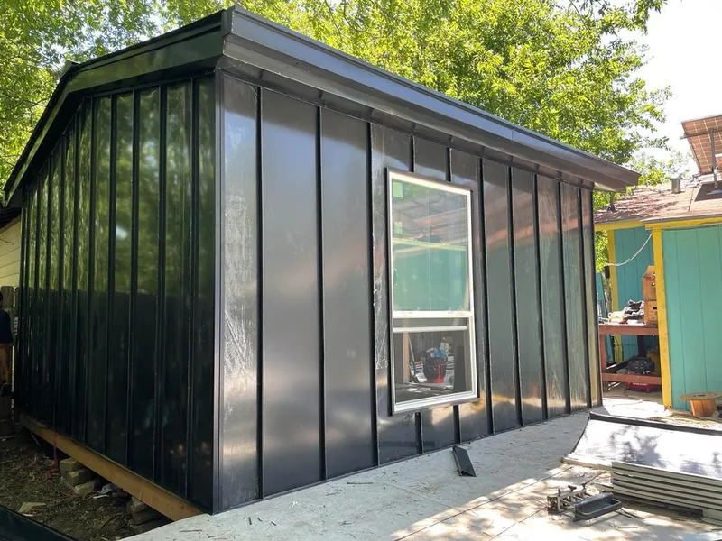 Black standing seam metal wall panels for Roof Inspection in Hannibal